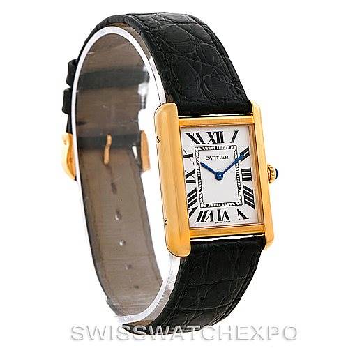 The image shows a Cartier Tank Solo W1018755 Women's Steel and Gold (two tone) Silver Dial W1018755 Women's Steel and Gold (two tone) Silver Dial watch from a side angle, highlighting its rectangular face, leather strap, and gold bezel.
