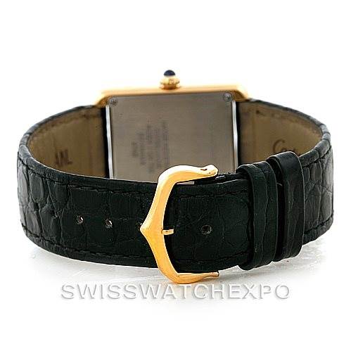 The image shows the backside and strap of a Cartier Tank Solo W1018755 Women's Steel and Gold (two tone) Silver Dial W1018755 Women's Steel and Gold (two tone) Silver Dial watch, featuring a black leather band and gold buckle.