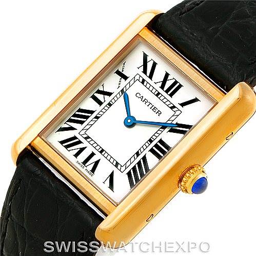 The image shows a close-up angle of the Cartier Tank Solo W1018755 Women's Steel and Gold (two tone) Silver Dial W1018755 Women's Steel and Gold (two tone) Silver Dial watch, highlighting its face, Roman numerals, and crown with a blue cabochon.