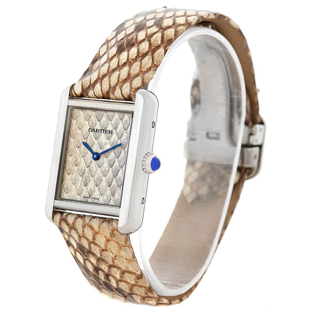 The image shows a front and side view of the Cartier Tank Solo W5200020 Women's Stainless Steel Blue Dial W5200020 Women's Stainless Steel Blue Dial watch, highlighting the face, crown, and patterned strap.