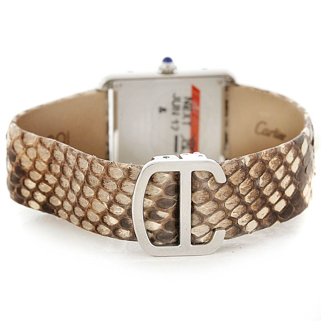 The image shows the back angle of a Cartier Tank Solo W5200020 Women's Stainless Steel Blue Dial W5200020 Women's Stainless Steel Blue Dial watch with a snakeskin strap and a distinctive "C" clasp.