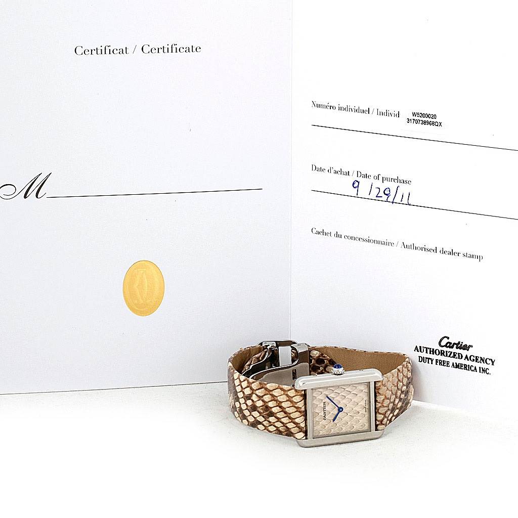 The image shows a Cartier Tank Solo W5200020 Women's Stainless Steel Blue Dial W5200020 Women's Stainless Steel Blue Dial watch with a snake-pattern band and its certificate of authenticity.