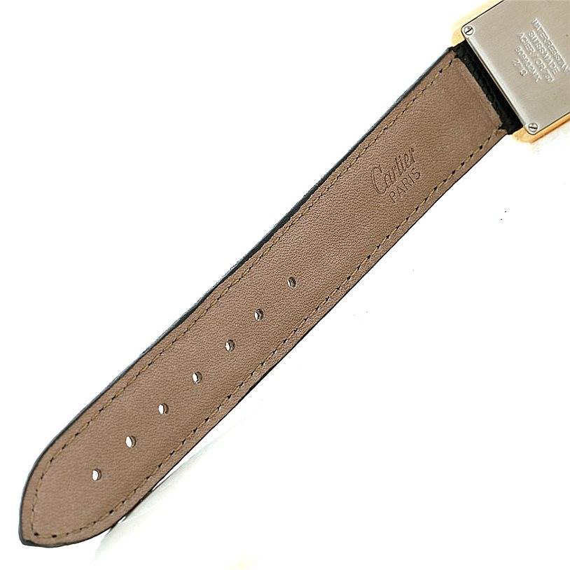 This image shows the leather strap and part of the case back of a Cartier Tank Solo W1018755 Women's Steel and Gold (two tone) Silver Dial W1018755 Women's Steel and Gold (two tone) Silver Dial watch.
