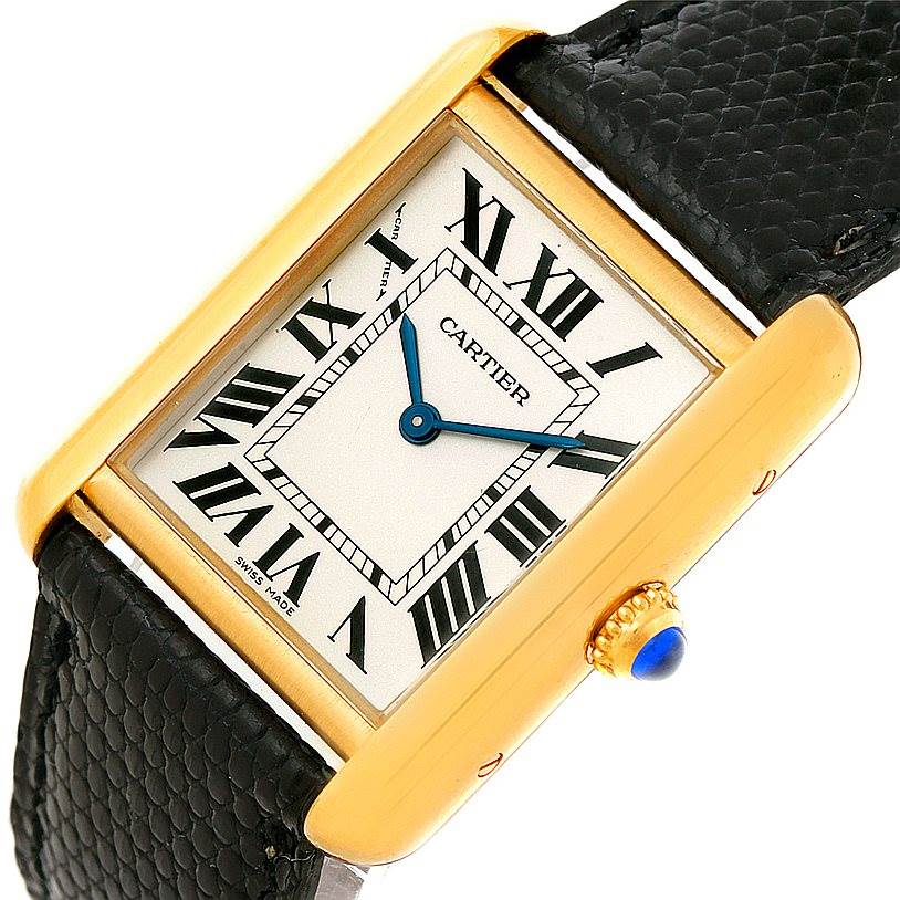 This Cartier Tank Solo W1018755 Women's Steel and Gold (two tone) Silver Dial W1018755 Women's Steel and Gold (two tone) Silver Dial model is shown at an angled close-up, highlighting the rectangular dial, Roman numerals, and black leather strap.