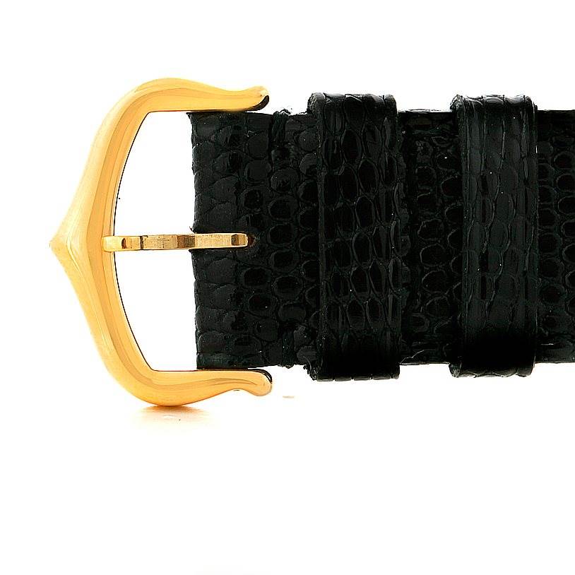 This image shows a close-up of the buckle and part of the black leather strap of a Cartier Tank Solo W1018755 Women's Steel and Gold (two tone) Silver Dial W1018755 Women's Steel and Gold (two tone) Silver Dial watch.