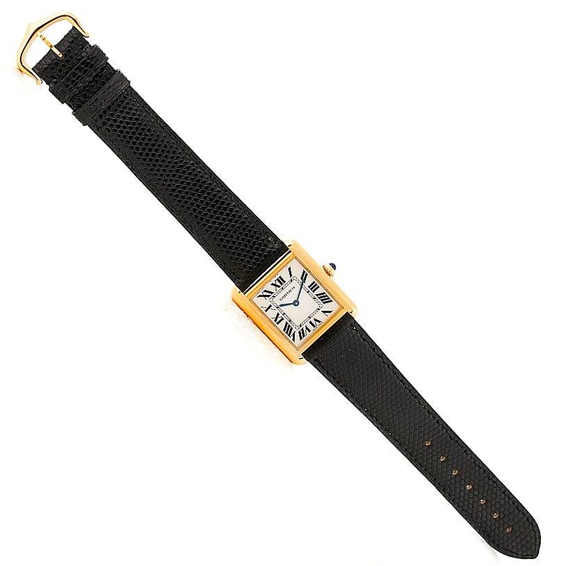 The image shows a Cartier Tank Solo W1018755 Women's Steel and Gold (two tone) Silver Dial W1018755 Women's Steel and Gold (two tone) Silver Dial watch, viewed from above, with its full face, black leather strap, and buckle visible.