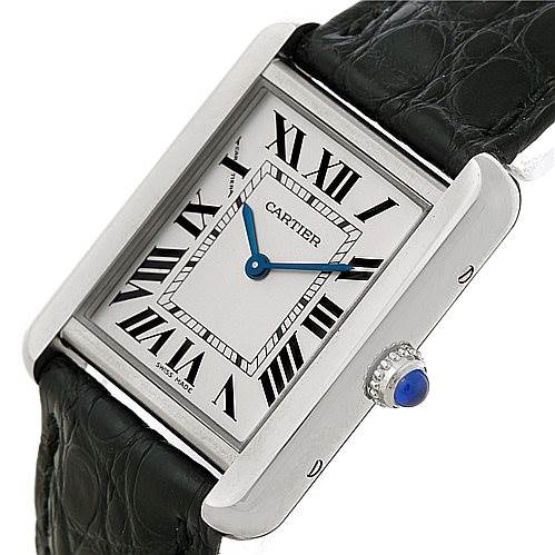 The image shows a Cartier Tank Solo W1018255 Women's Stainless Steel Silver Dial W1018255 Women's Stainless Steel Silver Dial watch angled slightly to the side, highlighting its face, Roman numerals, and crown with a blue cabochon.