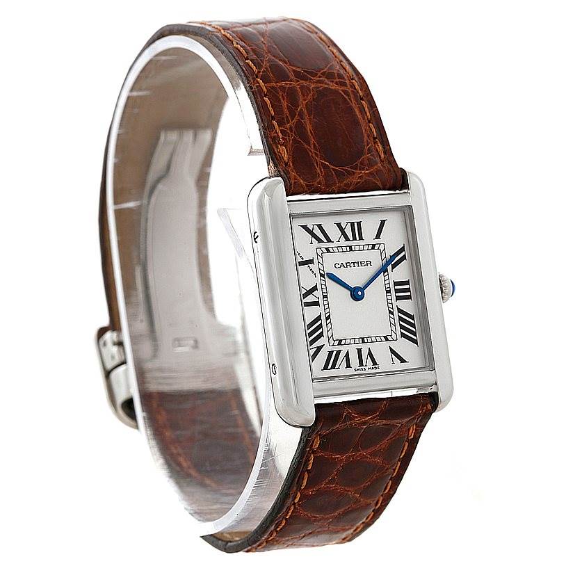 The image shows a Cartier Tank Solo W1018255 Women's Stainless Steel Silver Dial W1018255 Women's Stainless Steel Silver Dial watch at an angled view, highlighting its face, rectangular case, and brown leather strap.