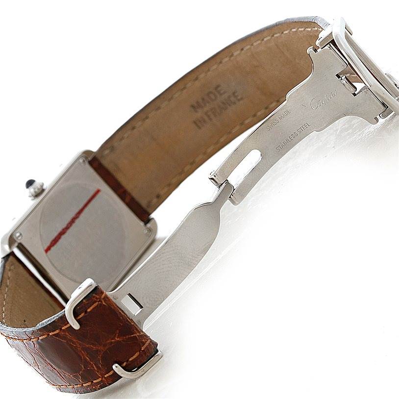 The image shows the back view of a Cartier Tank Solo W1018255 Women's Stainless Steel Silver Dial W1018255 Women's Stainless Steel Silver Dial watch with an open clasp and brown leather strap.