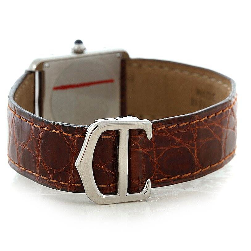 The image shows the back of the Cartier Tank Solo W1018255 Women's Stainless Steel Silver Dial W1018255 Women's Stainless Steel Silver Dial watch, highlighting its brown leather strap and Cartier "C" buckle.