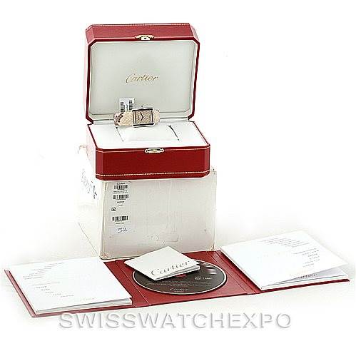 The image shows the Cartier Tank Solo W5200020 Women's Stainless Steel Blue Dial W5200020 Women's Stainless Steel Blue Dial watch in its case, along with accompanying documents and a CD, viewed from the front.