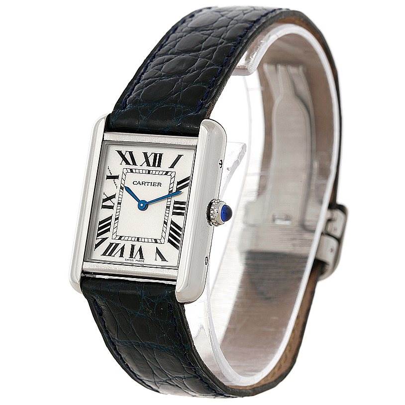The Cartier Tank Solo W1018255 Women's Stainless Steel Silver Dial W1018255 Women's Stainless Steel Silver Dial watch is shown at an angle highlighting the face, bezel, crown, and leather strap.