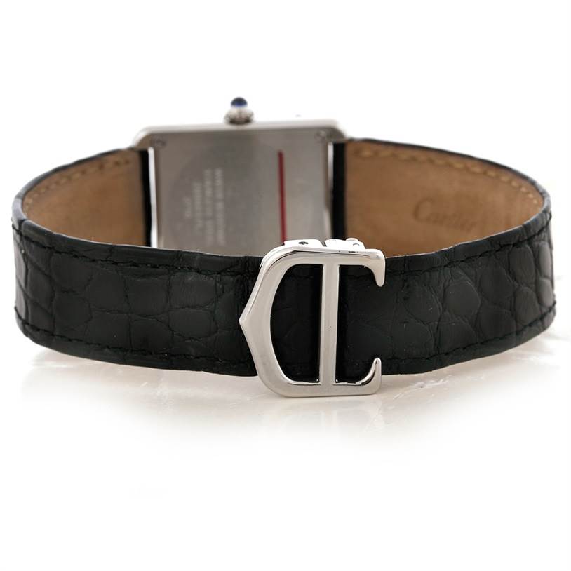 This image shows the back of a Cartier Tank Solo W1018255 Women's Stainless Steel Silver Dial W1018255 Women's Stainless Steel Silver Dial watch, featuring its black leather strap and metal buckle.