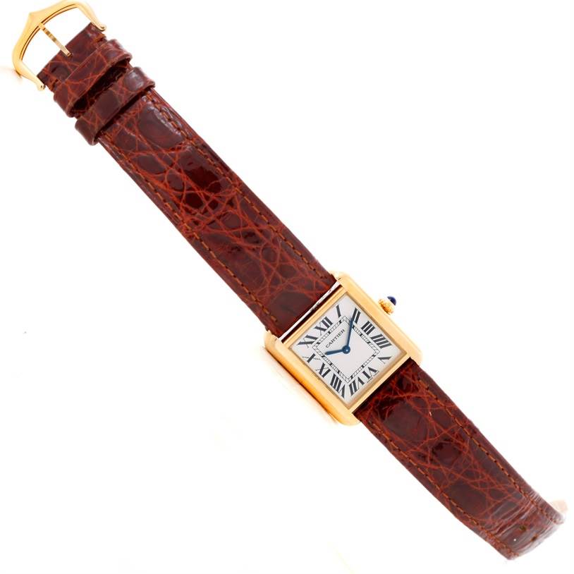 The image shows a Cartier Tank Solo W1018755 Women's Steel and Gold (two tone) Silver Dial W1018755 Women's Steel and Gold (two tone) Silver Dial watch with a focus on the face, leather strap, and buckle, angled slightly to the side.