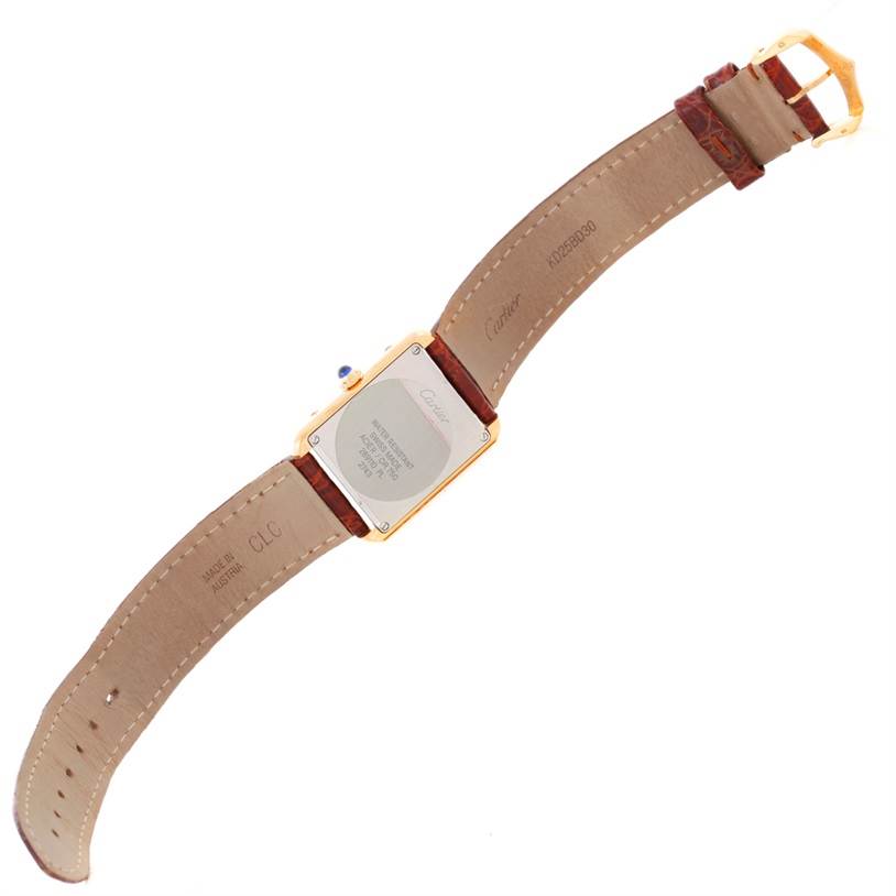 The Cartier Tank Solo W1018755 Women's Steel and Gold (two tone) Silver Dial W1018755 Women's Steel and Gold (two tone) Silver Dial watch is shown from the back, displaying the case back, leather strap, and buckle.