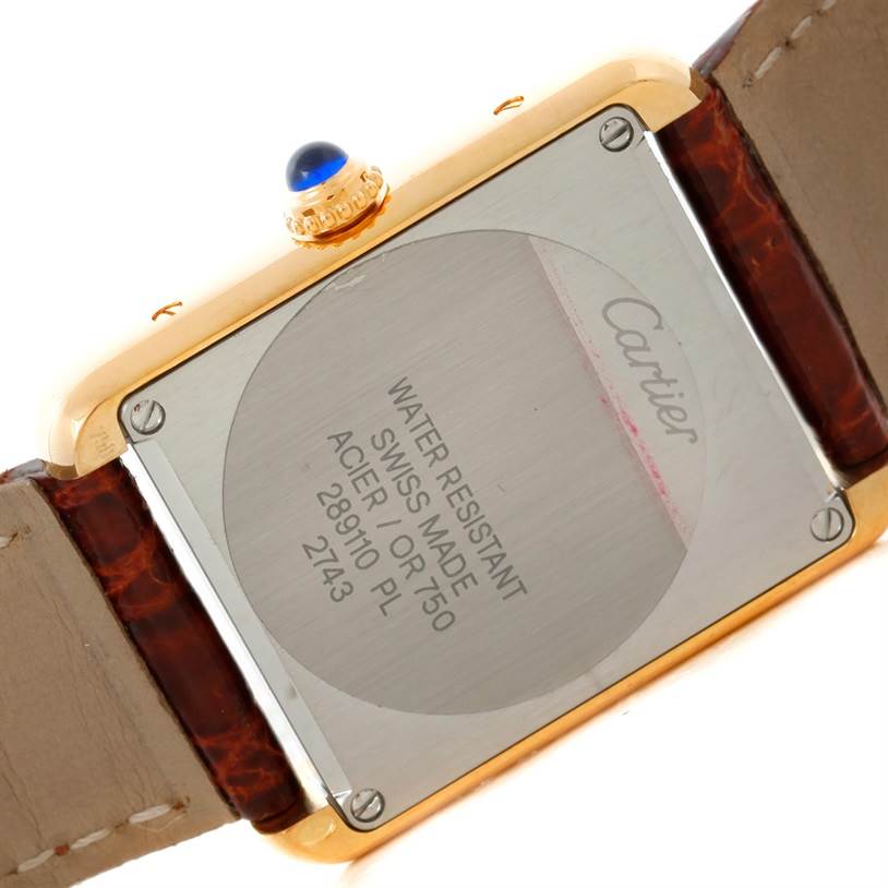 The image shows the back case of a Cartier Tank Solo W1018755 Women's Steel and Gold (two tone) Silver Dial W1018755 Women's Steel and Gold (two tone) Silver Dial watch, highlighting the engraving and details of the watch model.