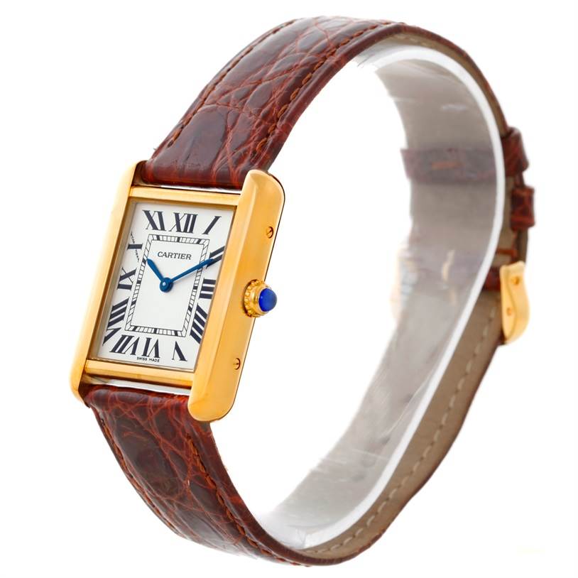 This image shows a Cartier Tank Solo W1018755 Women's Steel and Gold (two tone) Silver Dial W1018755 Women's Steel and Gold (two tone) Silver Dial watch at a slight angle, highlighting its face, crown with blue cabochon, and leather strap.