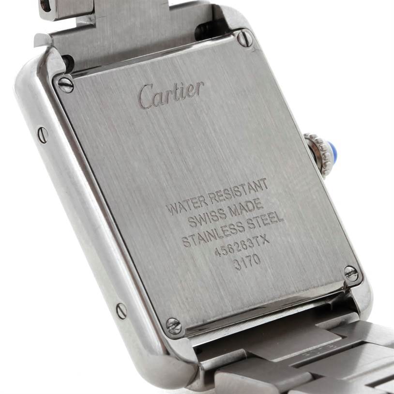 The image shows the back of a Cartier Tank Solo W5200013 Women's Stainless Steel Silver Dial W5200013 Women's Stainless Steel Silver Dial watch, highlighting its stainless steel case, engravings, and part of the bracelet.