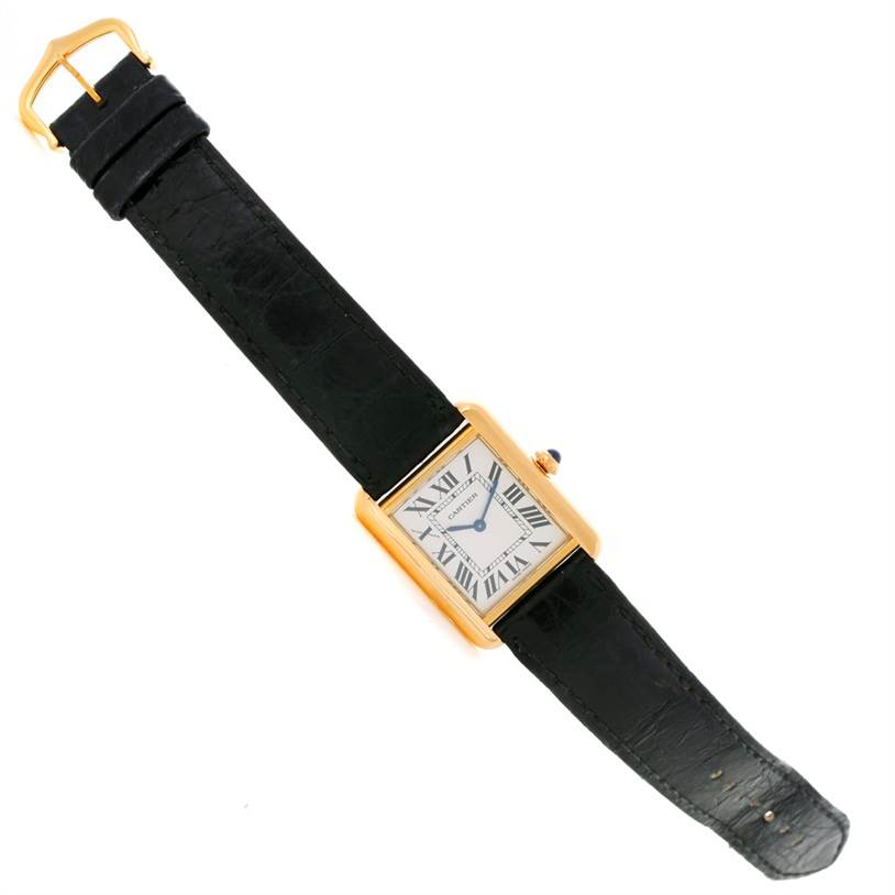 The image shows a top-down view of the Cartier Tank Solo W1018755 Women's Steel and Gold (two tone) Silver Dial W1018755 Women's Steel and Gold (two tone) Silver Dial watch, highlighting its face, black leather strap, and clasp.