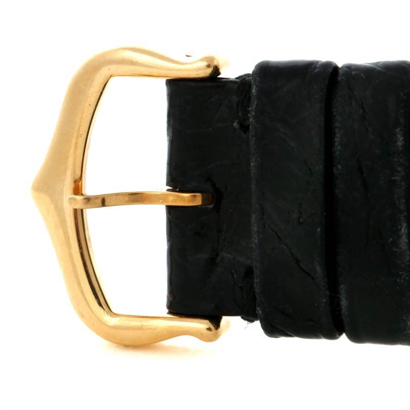 The image shows a close-up of the buckle and strap for the Tank Solo model by Cartier.