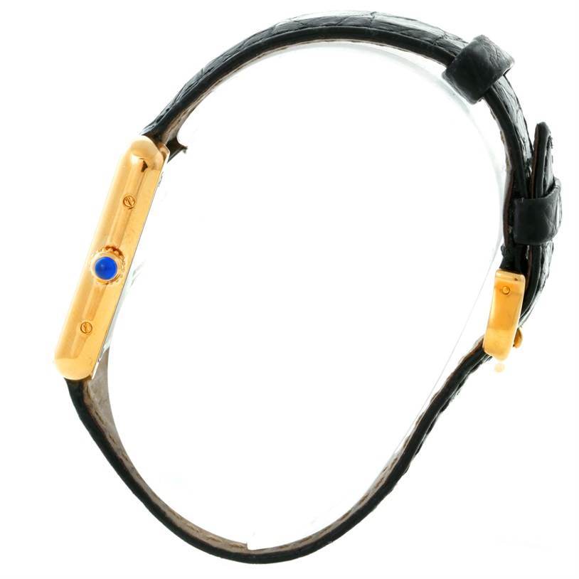 This image shows a side profile of the Cartier Tank Solo W1018755 Women's Steel and Gold (two tone) Silver Dial W1018755 Women's Steel and Gold (two tone) Silver Dial watch, highlighting its case, crown, and leather strap.