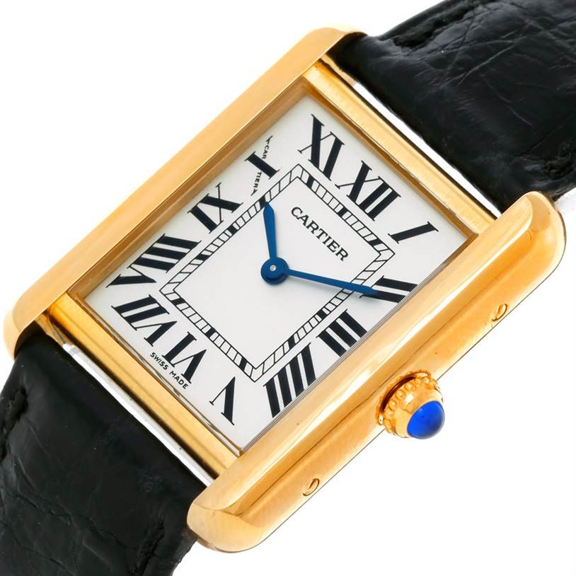 The image shows a close-up, high-angle view of the Cartier Tank Solo W1018755 Women's Steel and Gold (two tone) Silver Dial W1018755 Women's Steel and Gold (two tone) Silver Dial watch, highlighting its dial, hands, and part of its black strap.