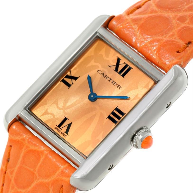 The image shows a Cartier Tank Solo W1019455 Women's Stainless Steel Orange Dial W1019455 Women's Stainless Steel Orange Dial watch at an angle displaying the face, hands, crown, and part of the orange leather strap.