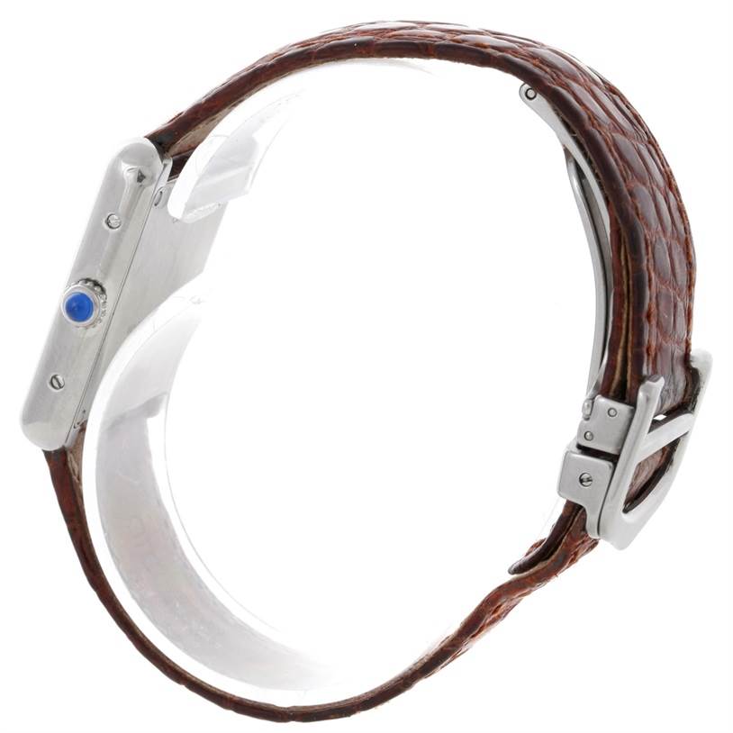 The Cartier Tank Solo W1018255 Women's Stainless Steel Silver Dial W1018255 Women's Stainless Steel Silver Dial watch is shown from the side, highlighting its brown leather strap and rectangular case with a cabochon crown.