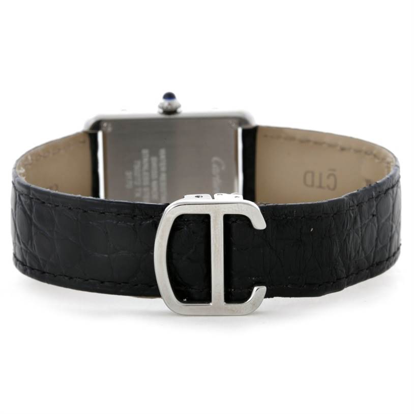 The image shows the back of a Cartier Tank Solo W1018255 Women's Stainless Steel Silver Dial W1018255 Women's Stainless Steel Silver Dial watch with a black leather strap and a silver "C" buckle.