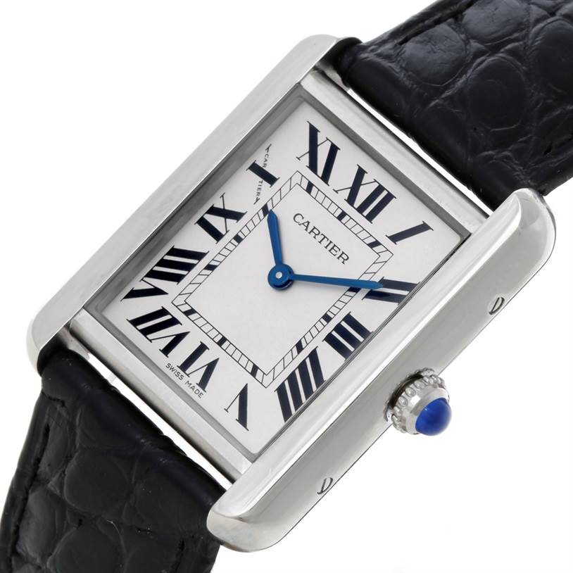 This image shows a Cartier Tank Solo W1018255 Women's Stainless Steel Silver Dial W1018255 Women's Stainless Steel Silver Dial watch at an angled close-up, highlighting the face, strap, and crown with a blue cabochon.