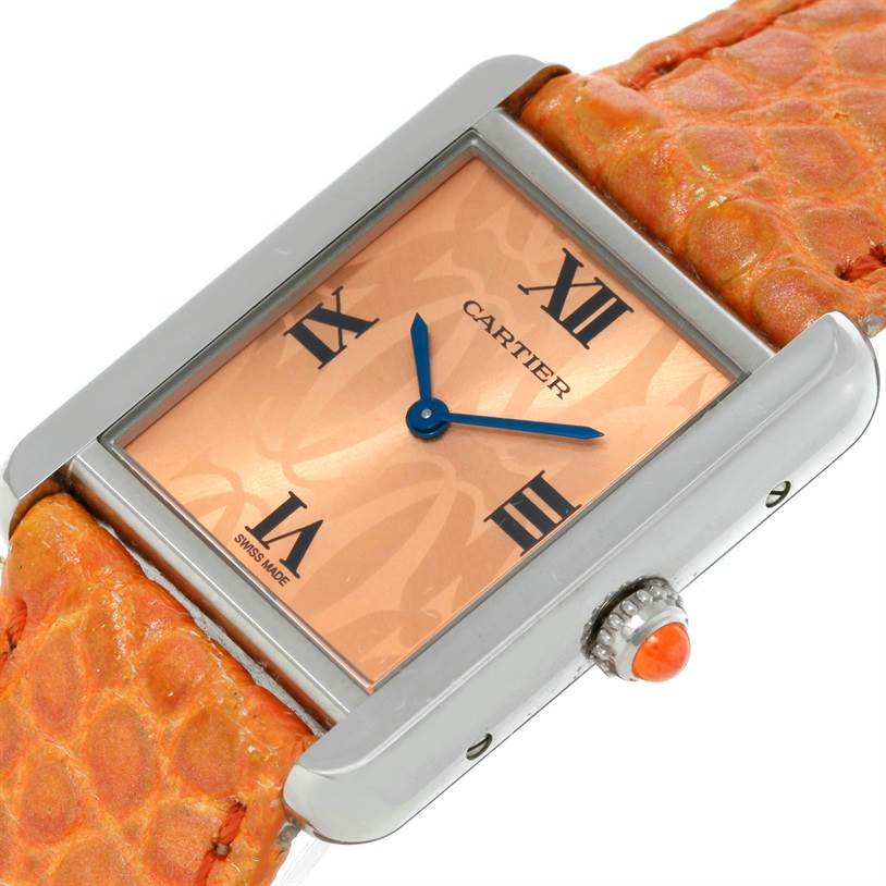 This image shows a close-up, angled view of the Cartier Tank Solo W1019455 Women's Stainless Steel Orange Dial W1019455 Women's Stainless Steel Orange Dial watch face and case with a textured orange strap.