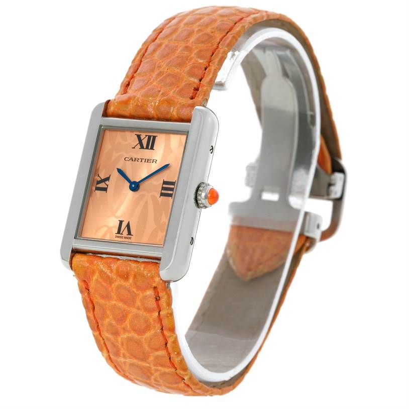 The image shows a Cartier Tank Solo W1019455 Women's Stainless Steel Orange Dial W1019455 Women's Stainless Steel Orange Dial watch with an orange strap, viewed from a front-side angle.
