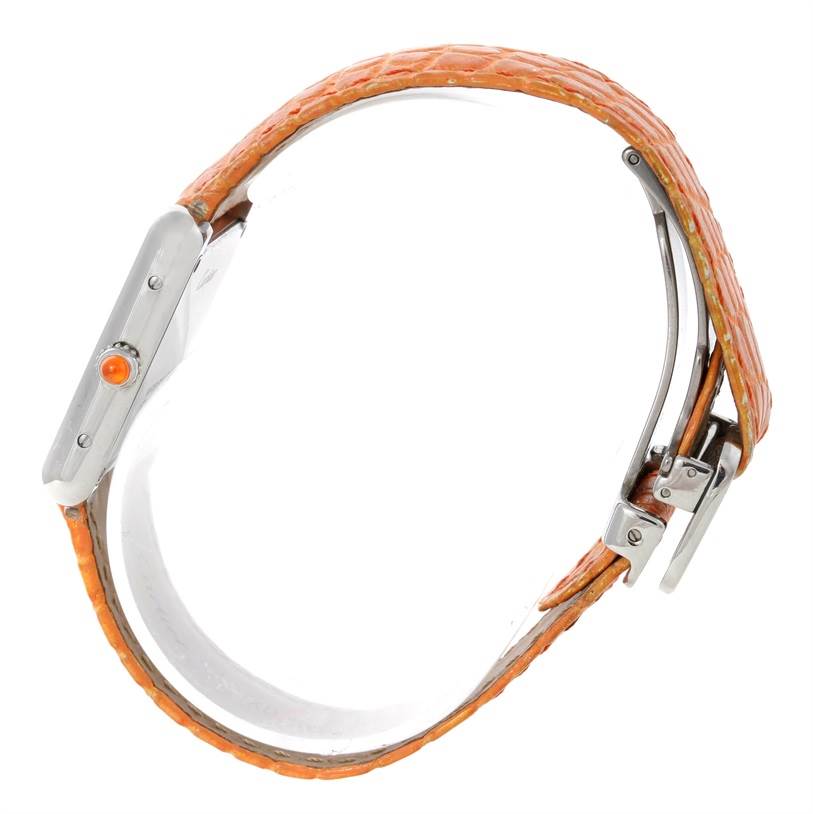 This image shows a side view of the Cartier Tank Solo W1019455 Women's Stainless Steel Orange Dial W1019455 Women's Stainless Steel Orange Dial watch, highlighting its orange leather strap and metal clasp.