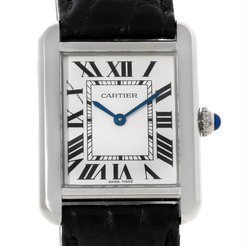 This image shows a front view of the Cartier Tank Solo W1018255 Women's Stainless Steel Silver Dial W1018255 Women's Stainless Steel Silver Dial watch, highlighting its face, Roman numerals, blue hands, and part of its black strap.
