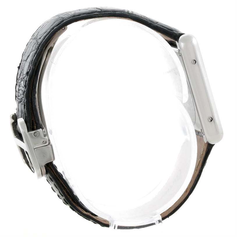 The image shows a side view of the Cartier Tank Solo W1018255 Women's Stainless Steel Silver Dial W1018255 Women's Stainless Steel Silver Dial watch, highlighting its leather strap and metallic case.