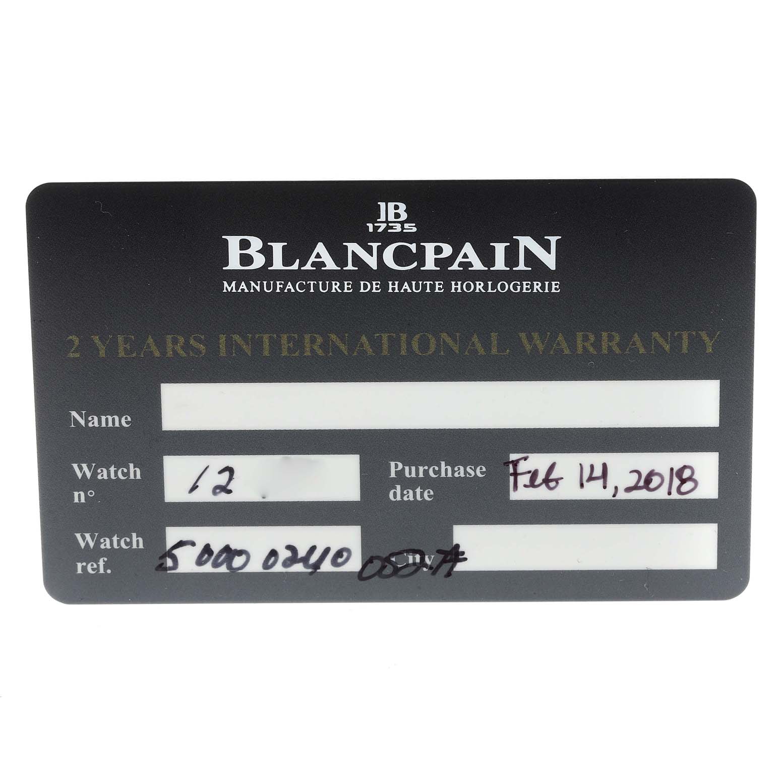 This image shows a warranty card for the Blancpain Fifty Fathoms 5000-0240-052A Men's Ceramic Blue Dial 5000-0240-052A Men's Ceramic Blue Dial watch, including details like the purchase date and watch reference number.