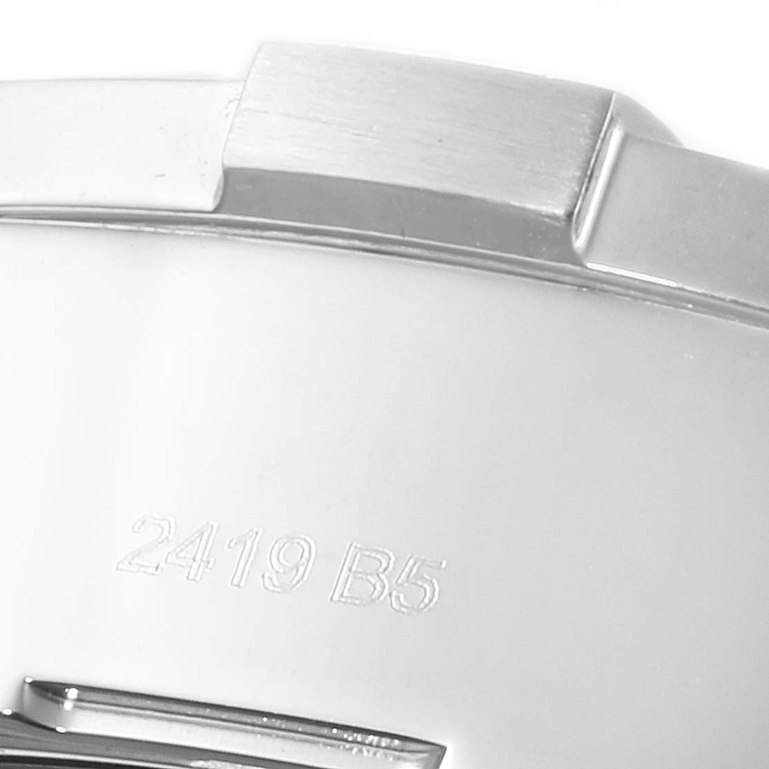 The image shows a close-up angle of the side of the case of an Avenger model by Breitling, displaying part of the bezel and case markings.