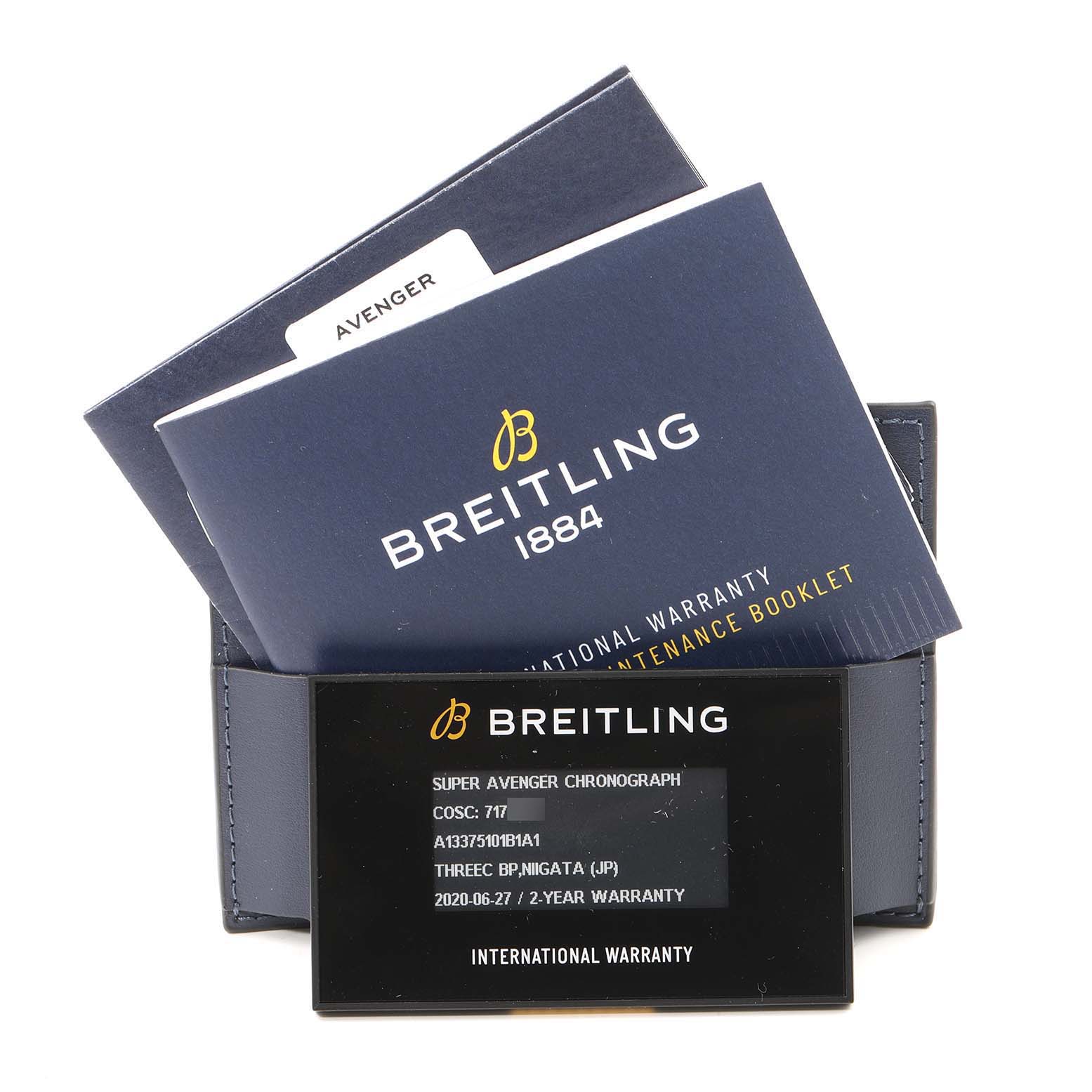 The image shows the Breitling Avenger A13375 Men's Stainless Steel Black Dial A13375 Men's Stainless Steel Black Dial model's warranty card, maintenance booklet, and a case from a front angle.