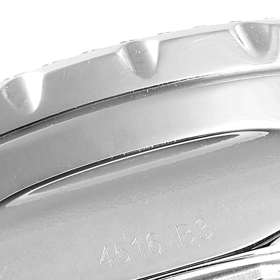 The image shows an angled close-up of the bezel and case of the Bentley model watch by Breitling, including the engraved detail.