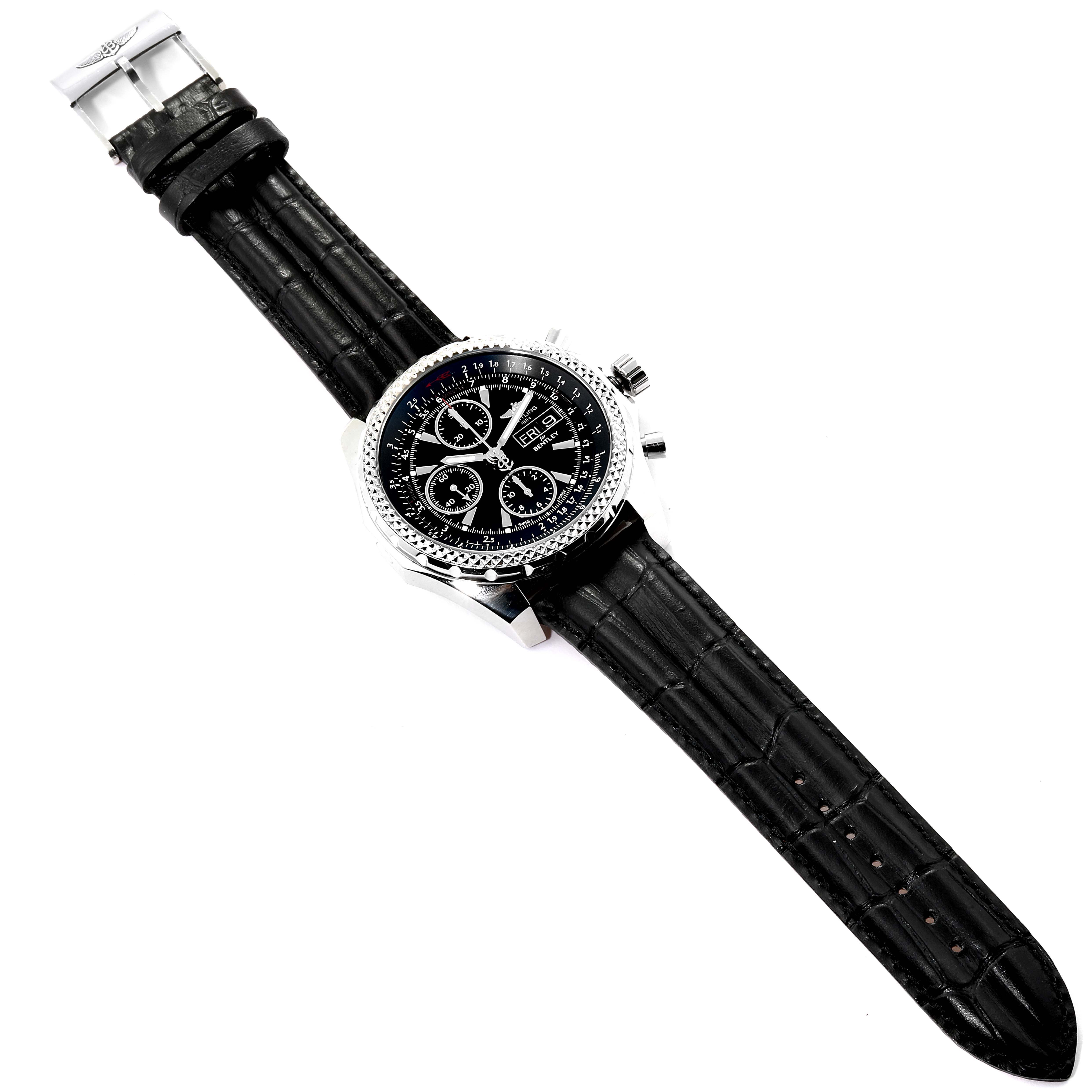 The image shows a Bentley model by Breitling from a top-down angle, featuring the watch face, black leather strap, and clasp.