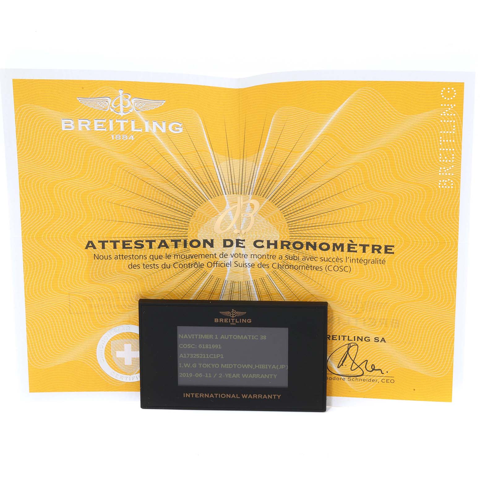 The image shows a Breitling Navitimer A17325 Men
s Stainless Steel Blue Dial A17325 Men
s Stainless Steel Blue Dial model’s chronometer certificate and international warranty card.