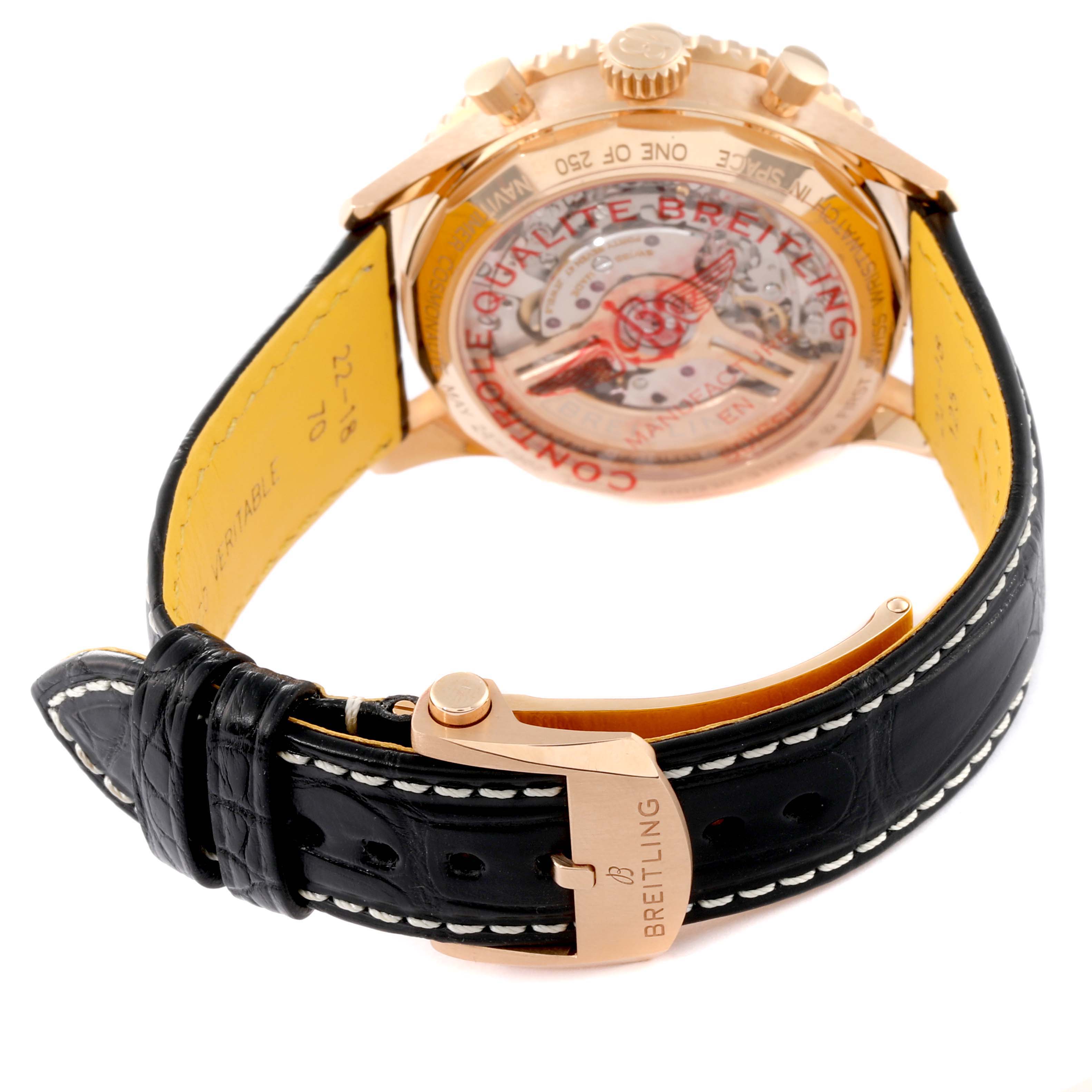 The image shows the back view of a Breitling Navitimer RB12302A1L1P1 Men's Rose Gold Green Dial RB12302A1L1P1 Men's Rose Gold Green Dial watch, highlighting the case back, movement, and leather strap with a buckle.