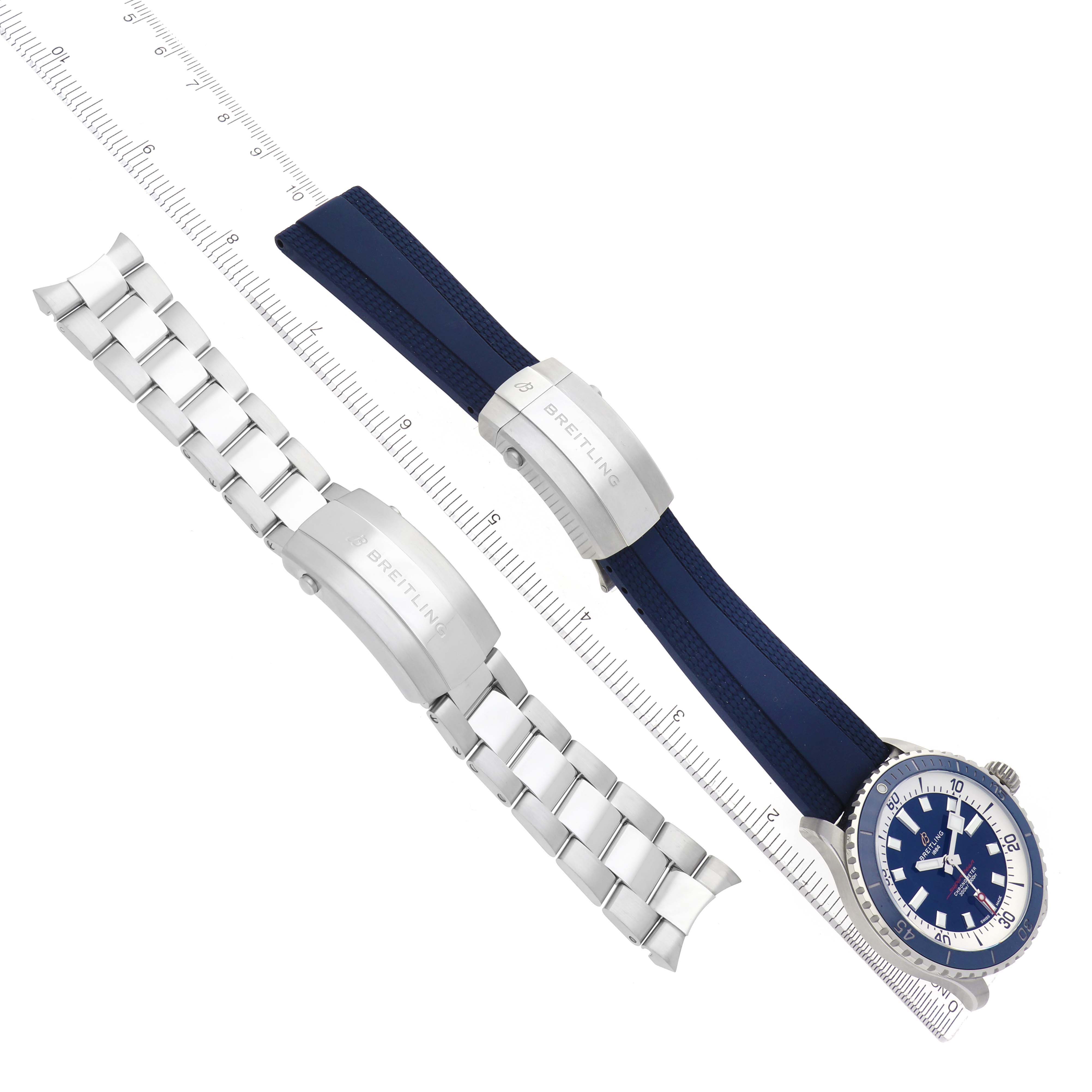 The image shows a Breitling Superocean A17375 Men
s Stainless Steel Blue Dial A17375 Men
s Stainless Steel Blue Dial watch at an angled side view, alongside its metal and rubber straps.