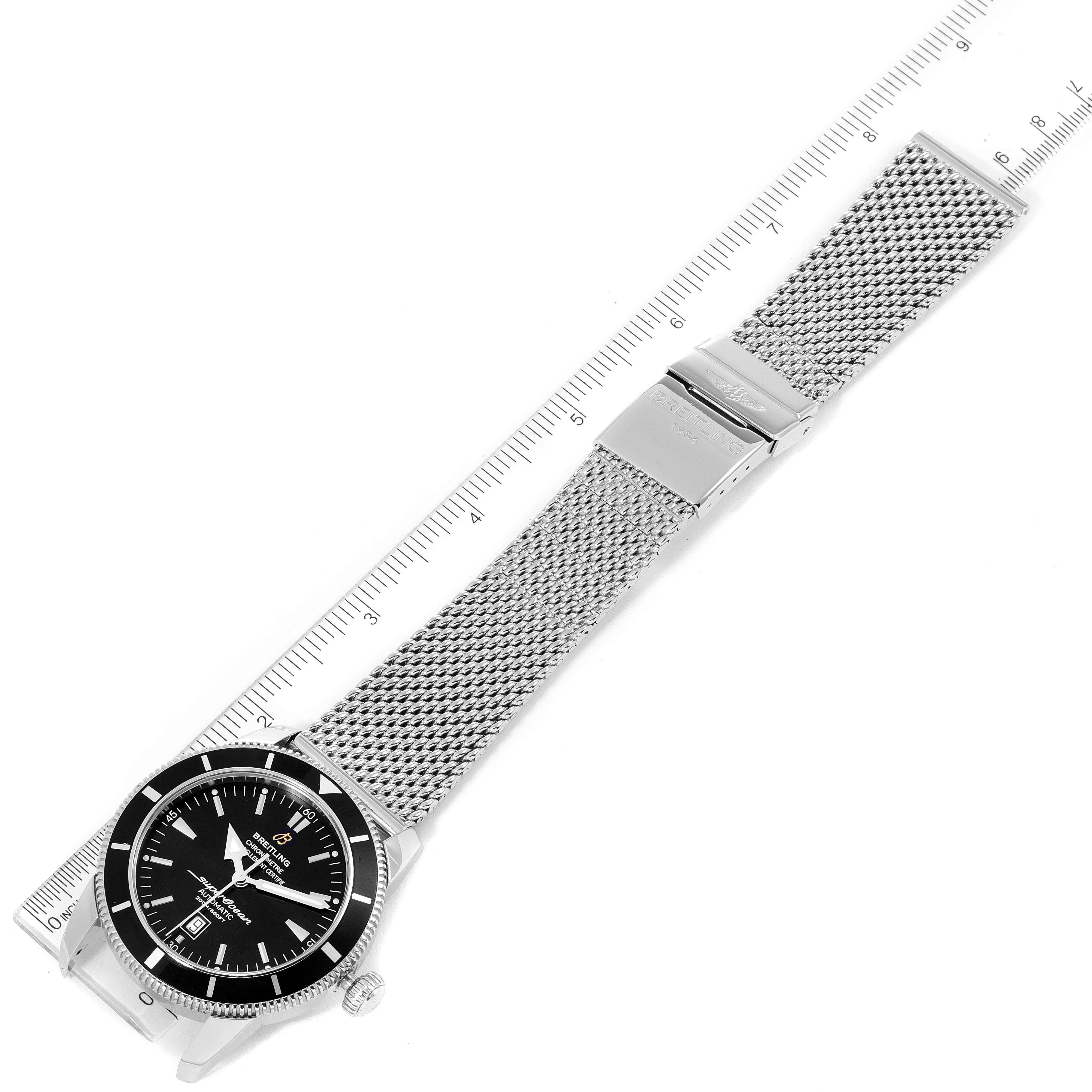 The image shows a top-down view of a Breitling Superocean A17320 Men's Stainless Steel Black Dial A17320 Men's Stainless Steel Black Dial watch with a mesh metal bracelet and deployment clasp.