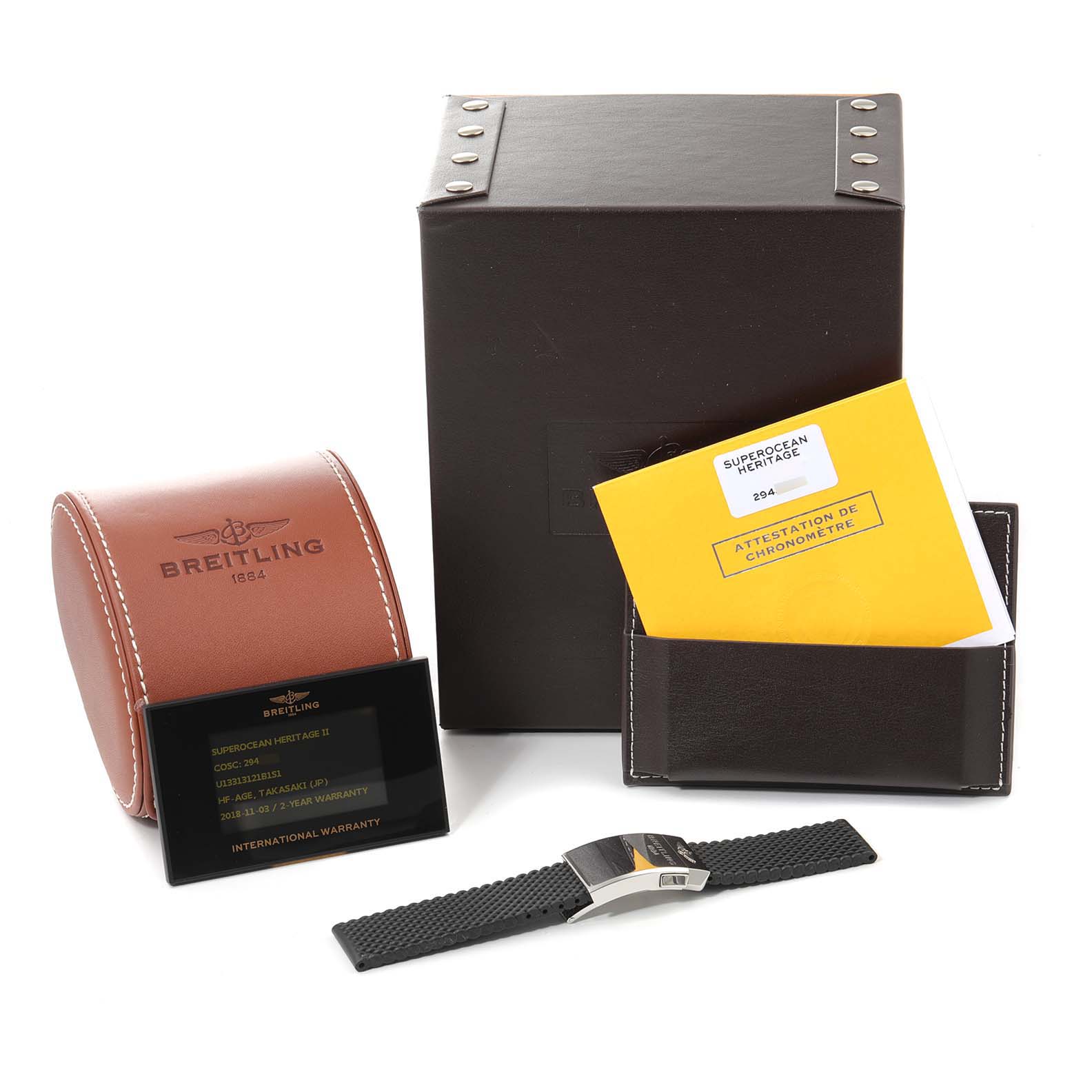 The image shows accessories for the Breitling Superocean U1331312/BG50/279S/A20D.4 Men's Stainless Steel Black Dial U1331312/BG50/279S/A20D.4 Men's Stainless Steel Black Dial, including the packaging, a leather case, a booklet, a warranty card, and a watch strap.