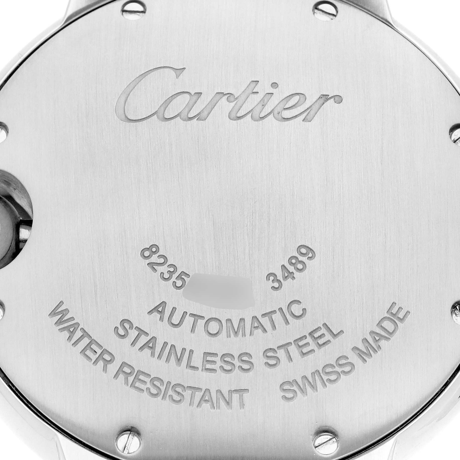 The image shows the back case of a Cartier Ballon Bleu WE902074 Women
s Stainless Steel Silver Dial WE902074 Women
s Stainless Steel Silver Dial watch, displaying the brand name and specifications like "Automatic" and "Stainless Steel."