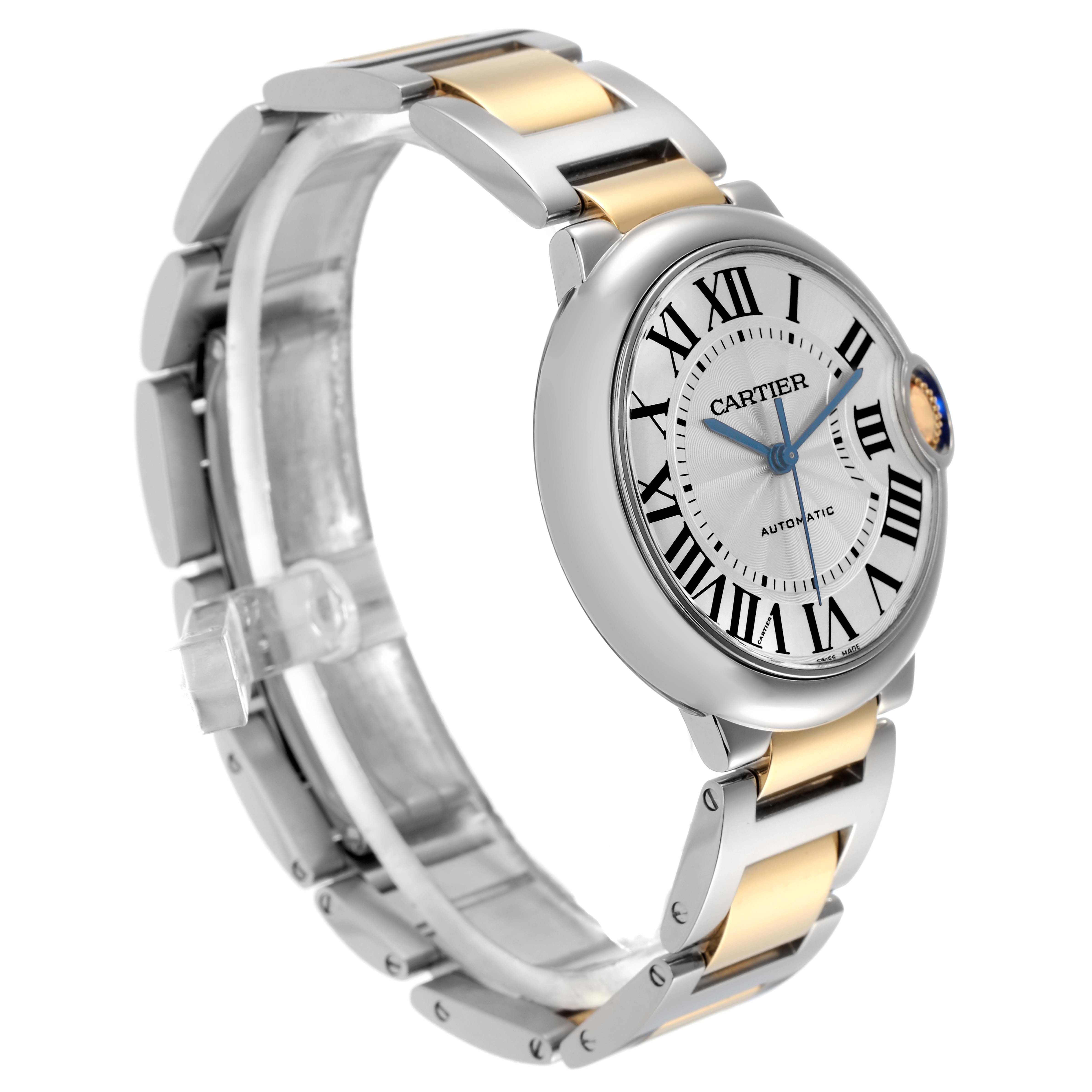 The Cartier Ballon Bleu W2BB0012 Women
s Steel and Gold (two tone) Silver Dial W2BB0012 Women
s Steel and Gold (two tone) Silver Dial watch is shown at an angled view, displaying the face, bracelet, and part of the crown.