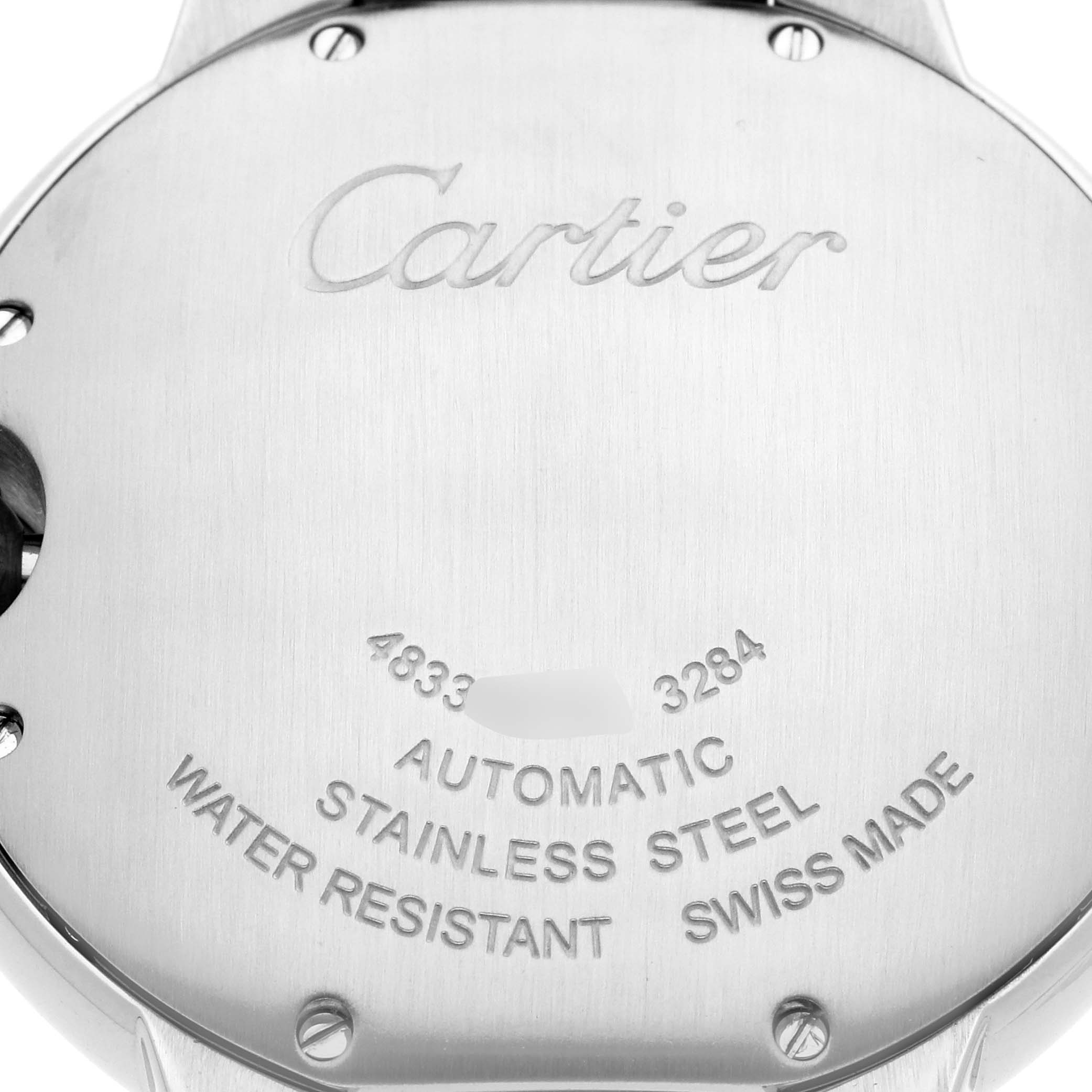 The image shows the back of a Ballon Bleu de Cartier watch, highlighting engravings and specifications.