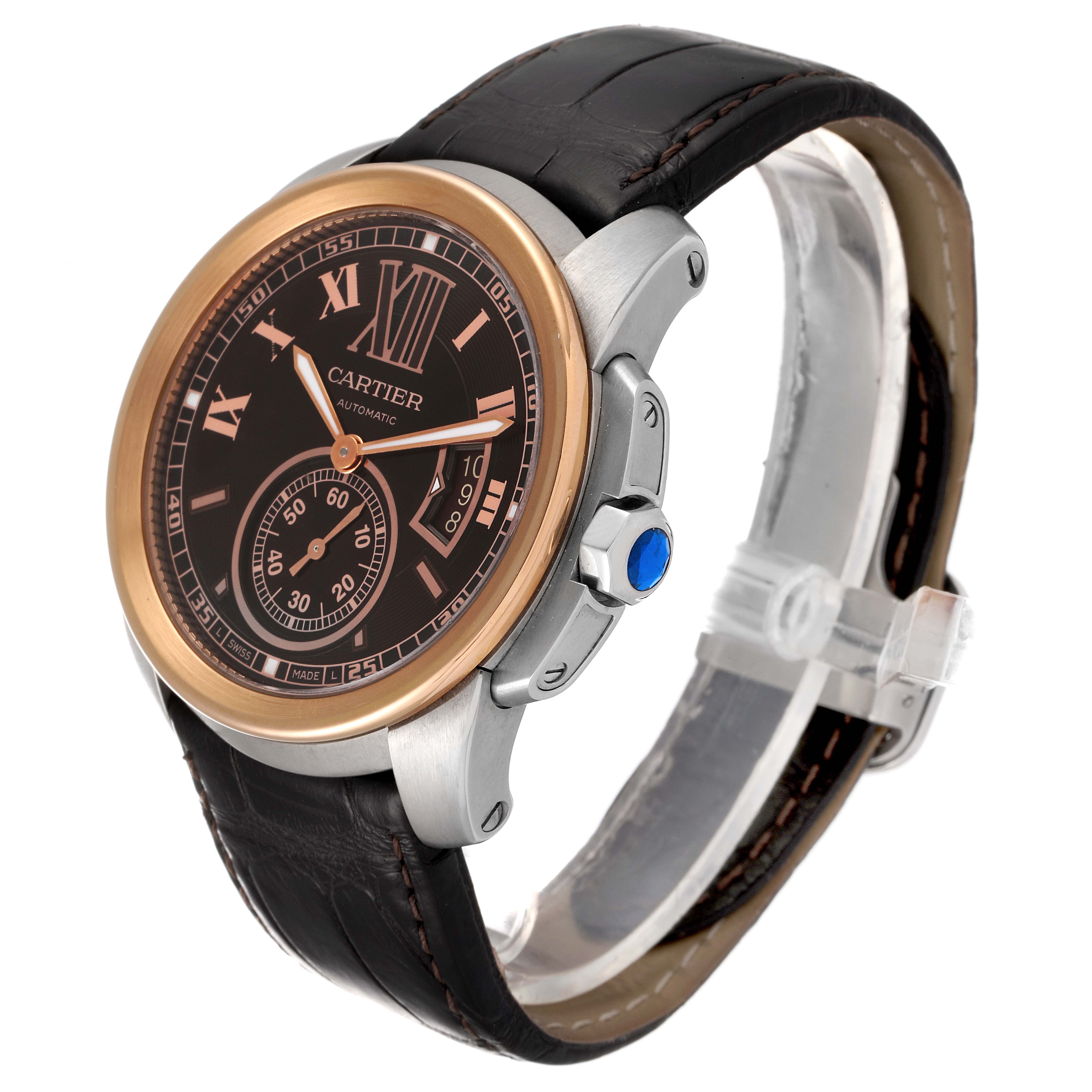 The image shows a Calibre de Cartier watch by Cartier from a front and slightly right-side angle, highlighting the dial, crown, and strap.