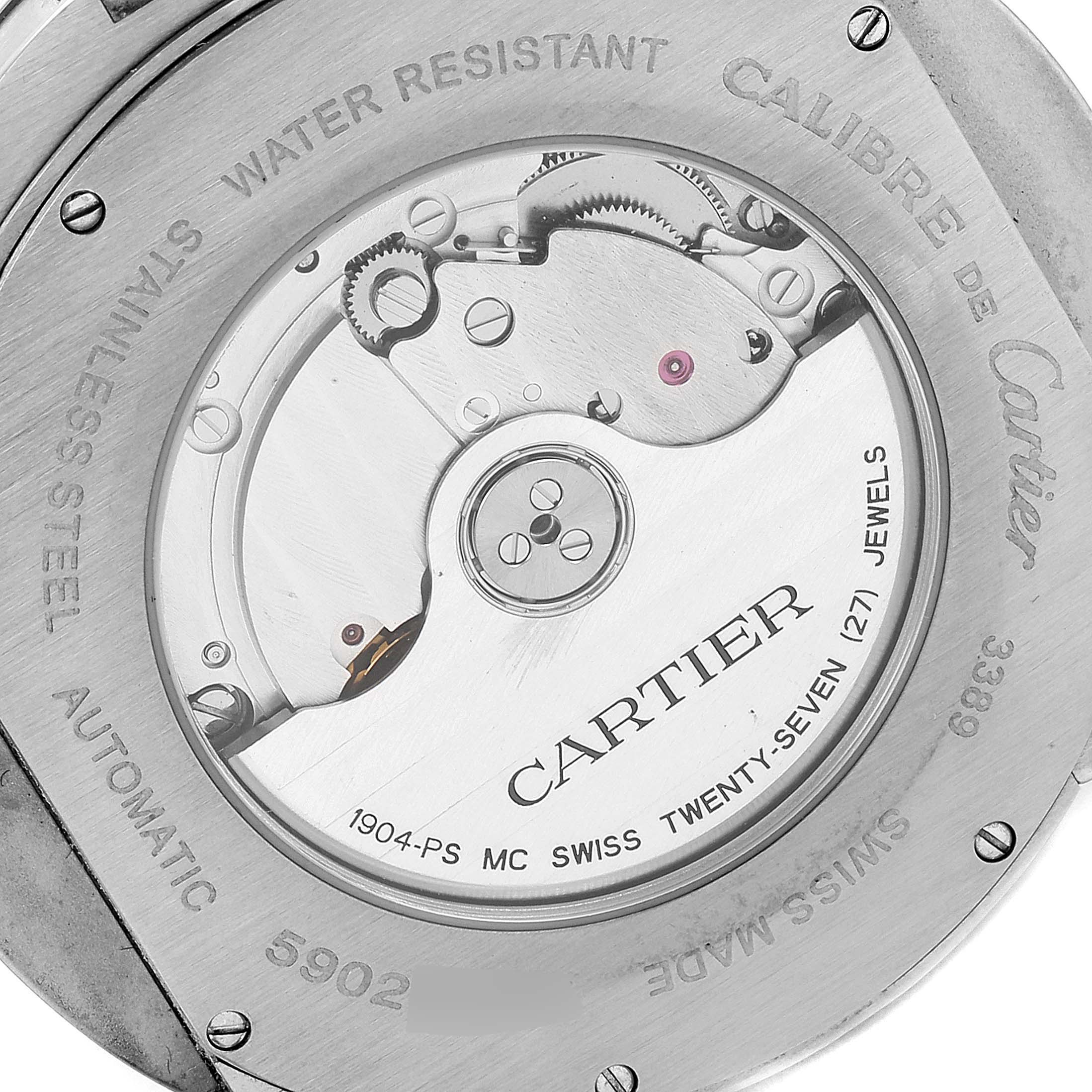 This image shows the back of a Calibre de Cartier watch by Cartier, highlighting its automatic movement and internal mechanics.